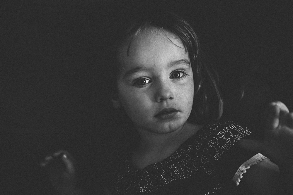 Black and white moody portrait of toddler