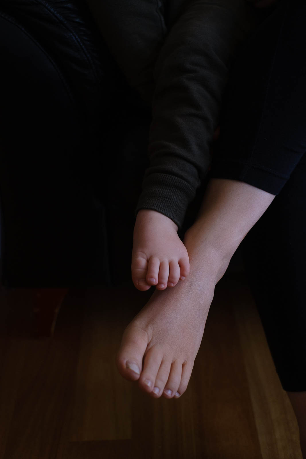 Colour image of mother and son's feet and toes